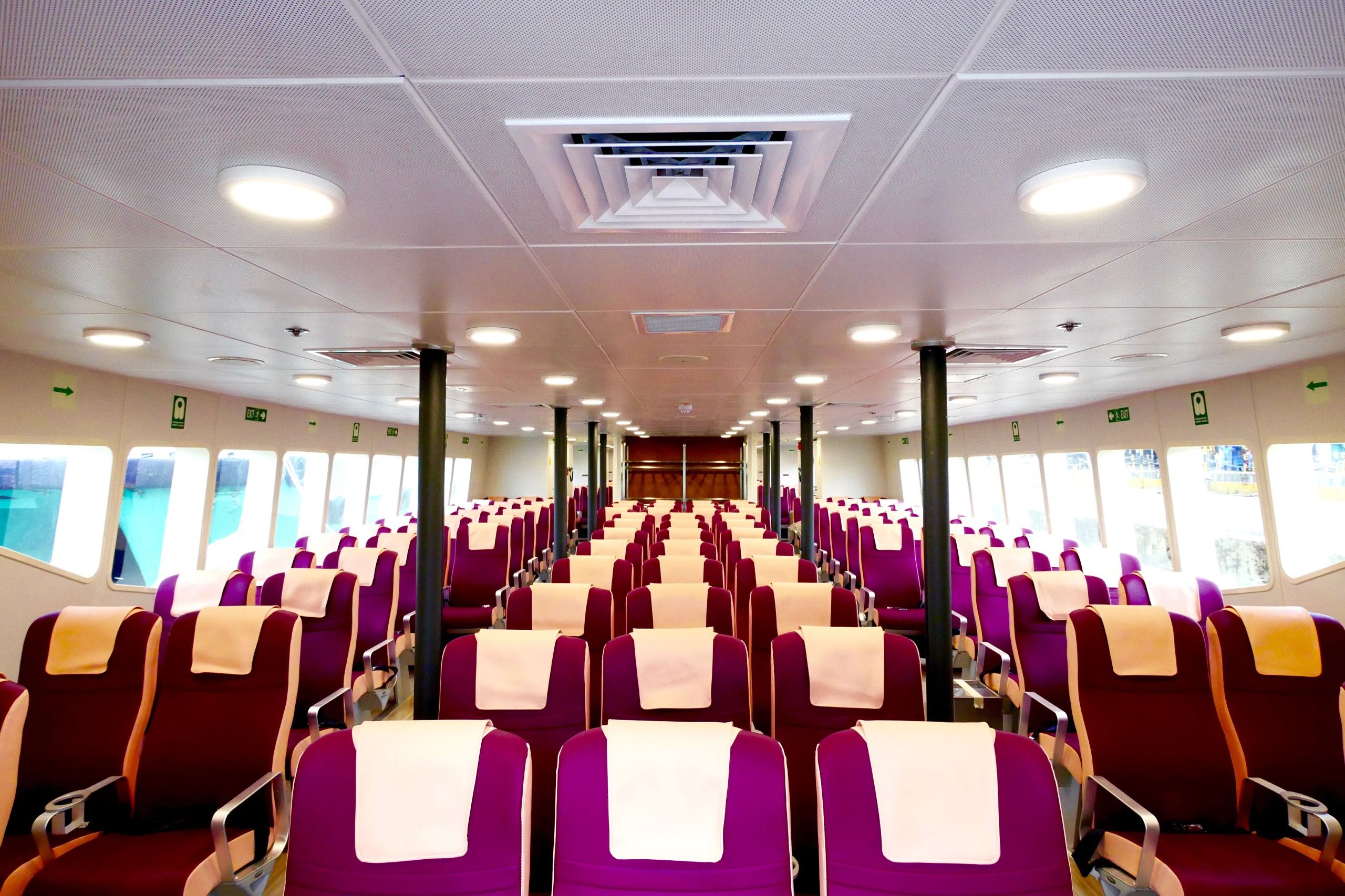 Economy Class cabin with orange plush seating
