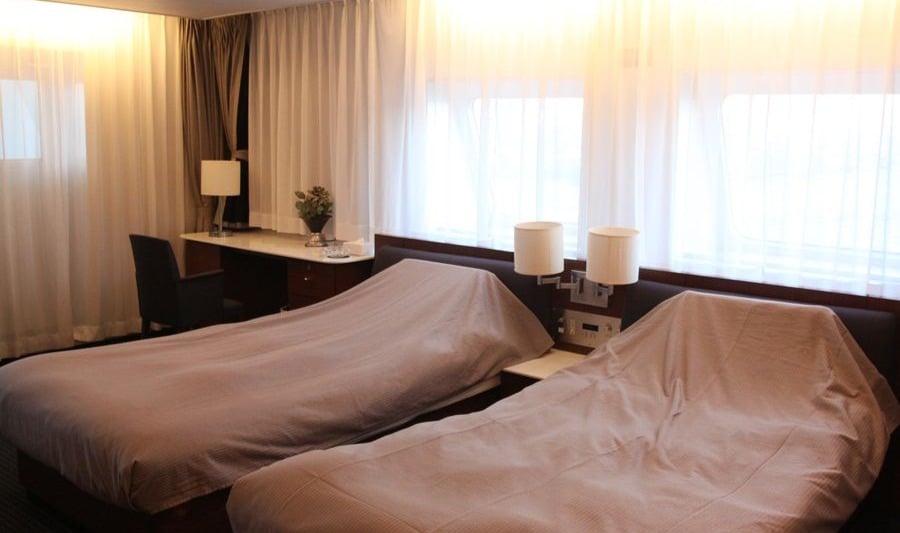 Royal Suite twin cabin interior on the New Camellia